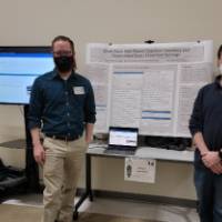 2 people in front of their project